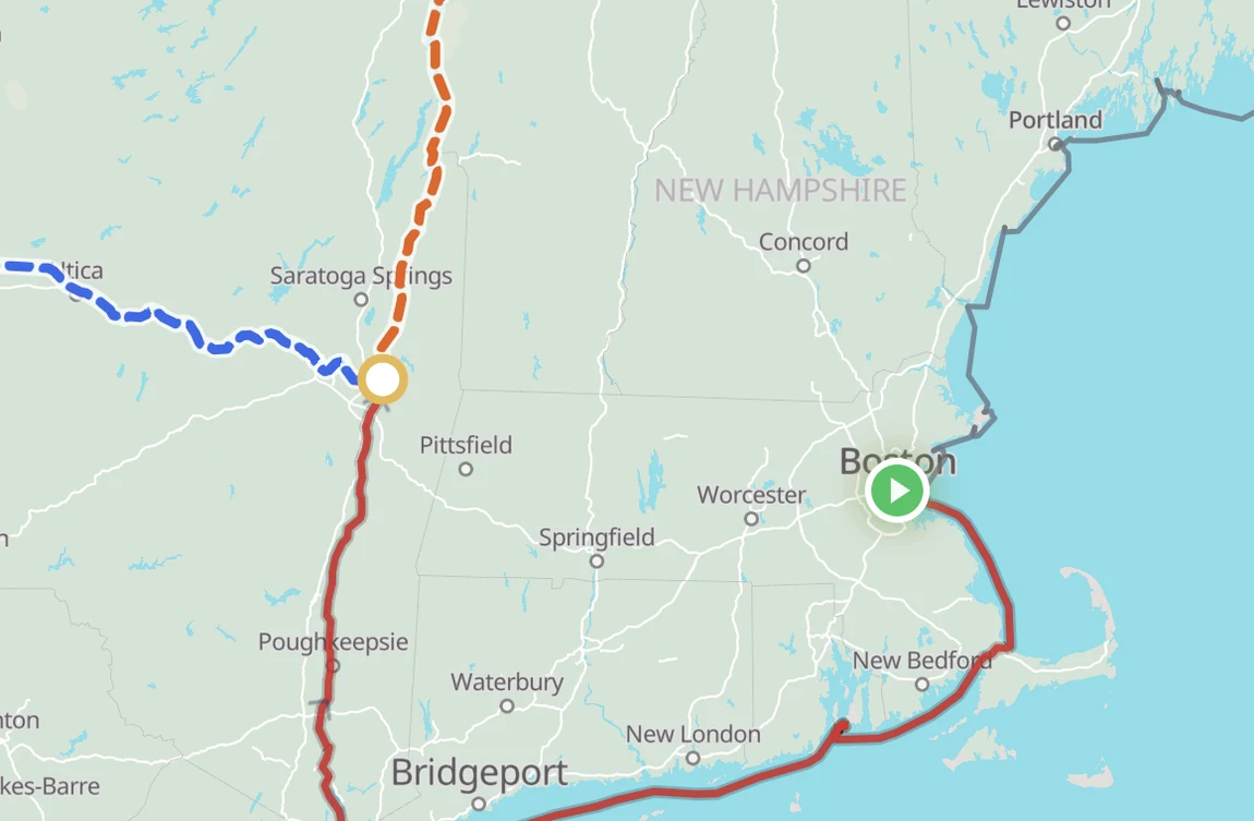The builder map at the Waterford junction north of New York: a blue dashed Erie Canal leg heading west and an orange dashed Champlain Canal leg heading north, each its own highlighted choice.