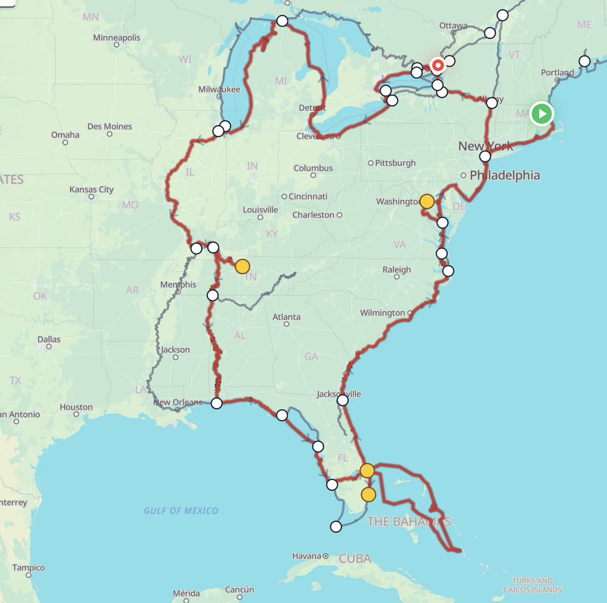 Loop Captain's route builder showing a full custom Great Loop drawn in dark red across the eastern U.S. — up the Hudson, across the Great Lakes, down through the inland rivers, around Florida and the Bahamas, and back up the coast — with white junction dots and yellow side-trip markers along the way.