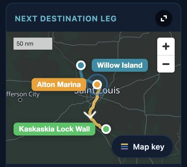 My Trip's next destination leg map in dark mode on a phone: slate land, roads and town names readable, the leg from Alton Marina past St. Louis to Kaskaskia Lock Wall.